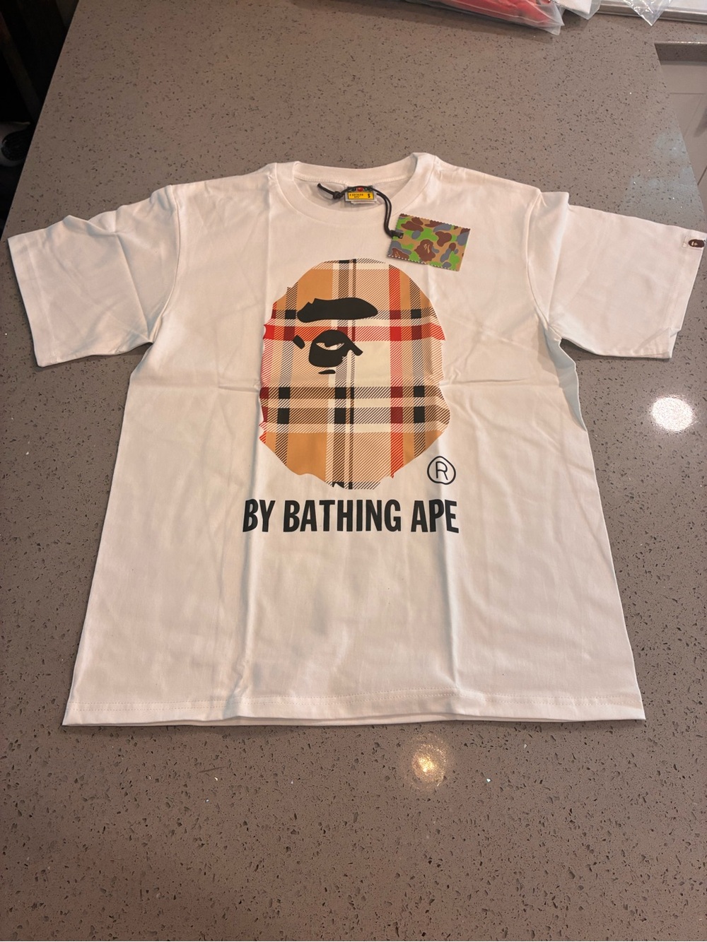 Bape White Tee with Tan Plaid Ape Head Graphic